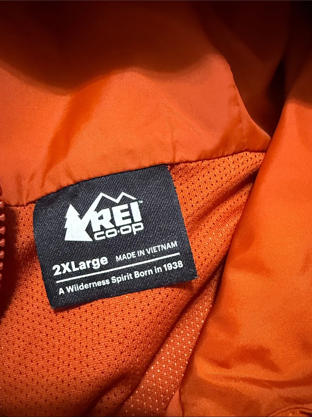 REI Men’s Bright Orange Hooded Rain Jacket